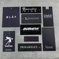 Wholesale Custom Luxury Embossed Garment Tags Golden Stamping Brand Logo Black Recycled Special Paper Hang Tag for Clothing