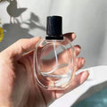China Custom 30ml Transparent Round Empty Perfume Bottle Luxury Glass Perfume Bottles with Black Sprayer