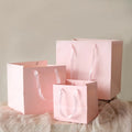 Customized Luxury Silk Ribbon Packing Paper Shopping Bag with Handle Printed Logo Flower Design