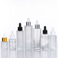 2026 Hot Sale 30ml 50ml 60ml 80ml 100ml clear Color  Round Cylinder Flat Shoulder Glass Dropper Bottle for Serum Essential Oil
