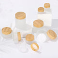 5g10g15g30g50g100g Luxury Empty Cream Cosmetic Frosted clear Glass Jars with Wood Grain Lids