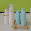 Free Sample 15ml 20ml 30ml 50ml pink Blue Black White Plastic Cosmetic Vacuum Bottle Serum Bottle with Cap