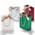 Custom Logo Printed Black Matt Finish White Pink Luxury Jewelry Paper Gift Bag With Ribbon Bow Closure