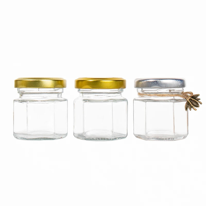 Top Seller 40ml 100ml Hexagon Food Storage Glass Honey Jar with Screw Lids Custom Logo Packaging