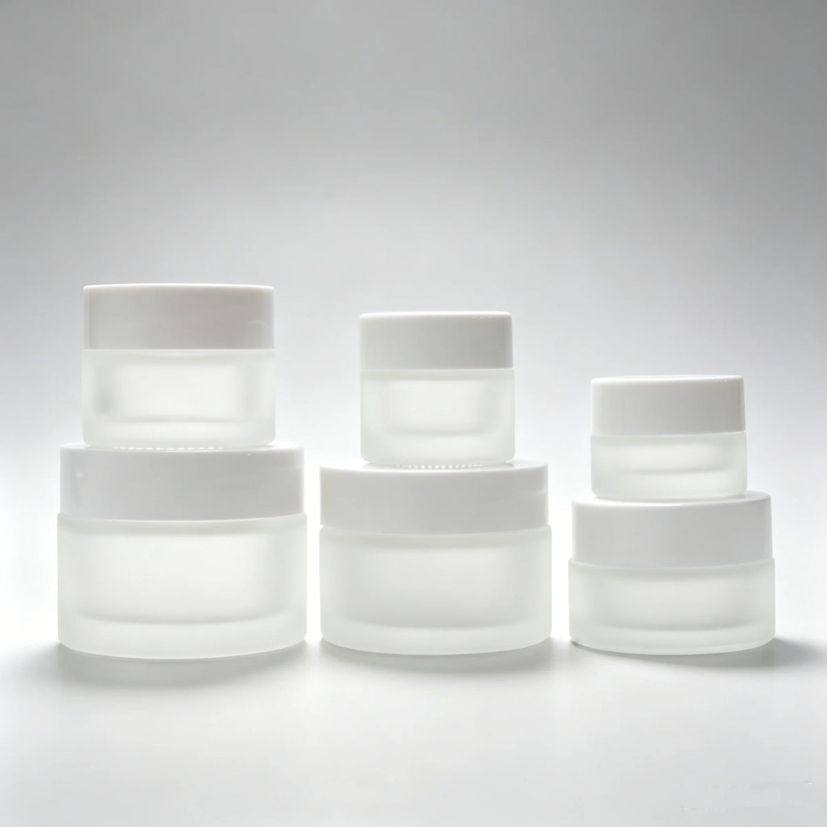 Customized Luxury Frosted Cosmetic Glass Cream Jars 50ml 50g Frosted Glass Eye Facial Cream Jar with White Plastic Lids