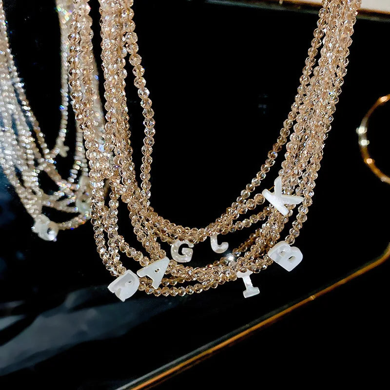 Fashion Charm Jewelry Champagne Crystal Letter Pendant Fritillaria Beaded Choker Puka Shell Beaded Necklace with Shell