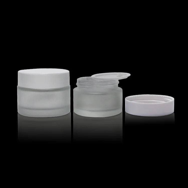 Customized Luxury Frosted Cosmetic Glass Cream Jars 50ml 50g Frosted Glass Eye Facial Cream Jar with White Plastic Lids