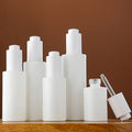 Customized White Glass Cosmetic Bottles for Lotion Serum Oil Cosmetic Package with Pressing Droppper Glass Bottles