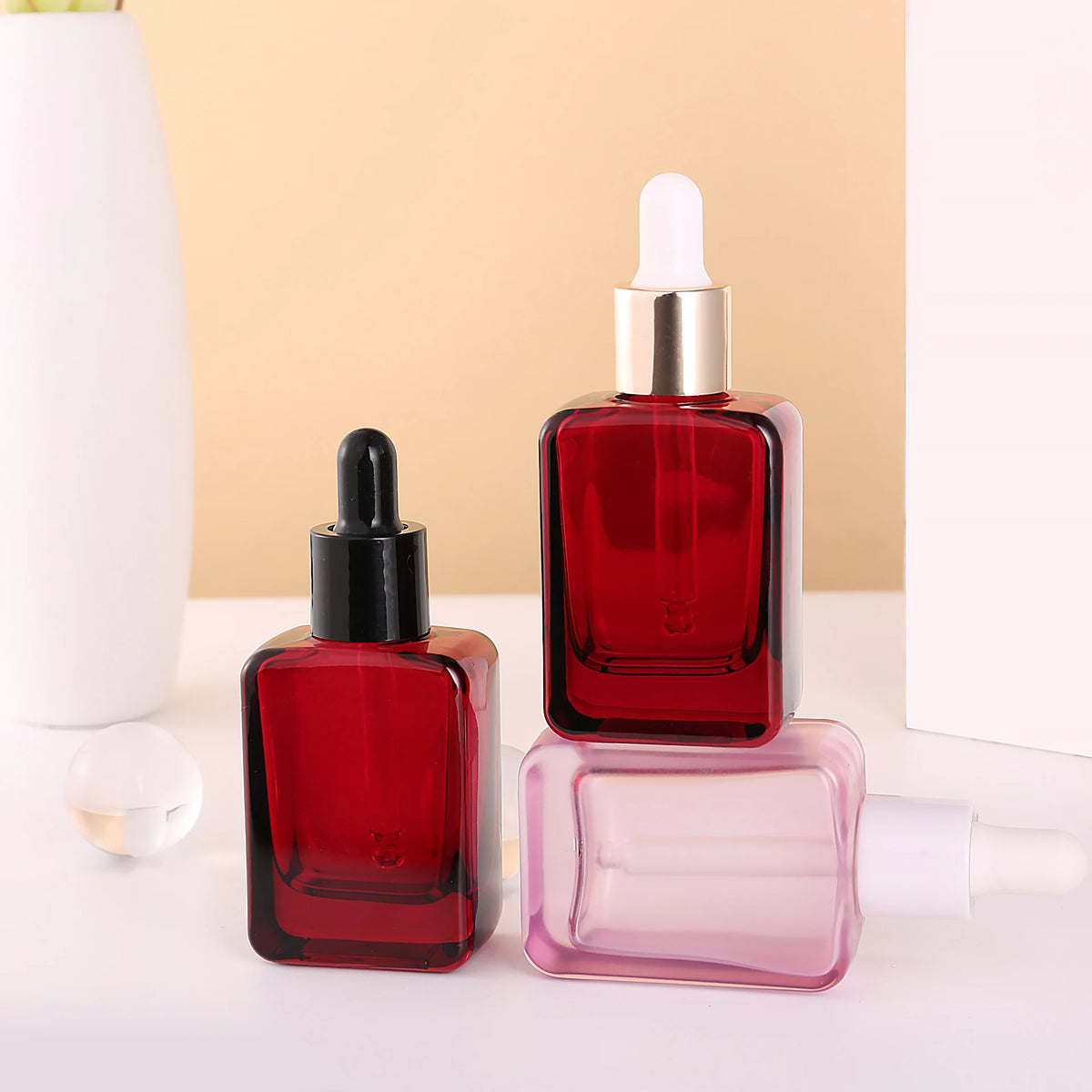 Customizable 30ml Glass Dropper Square Bottle in Red Purple clear Colors with Gold Black White Lid and White Rubber for Skincare