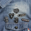 Hot Sale New Style Black Metal Lapel Pins Cheap Wholesale Heart Hollow Out Hand Brooch Custom Letter Metal Black Pin with Witch