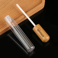 Hot Selling Cosmetic 5ml Bamboo Lid Shell Empty Cosmetic Plastic Lipstick Tube Container Lip Gloss Tube Liquid Bottles
