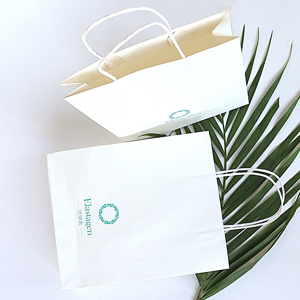 Wholesale OEM White Kraft Fancy Shopping Paper Bag with Handles Custom Logo for Clothing and Shoes