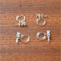U-shaped ear clip with transparent pearl transformed into earrings without piercing studs