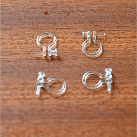U-shaped ear clip with transparent pearl transformed into earrings without piercing studs