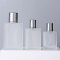 China 50ml 100ml Elegant Refillable Frosted Portable Glass Perfume Bottle with Mist Pump Sprayer Lids