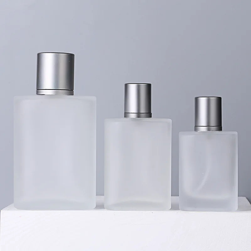 China 50ml 100ml Elegant Refillable Frosted Portable Glass Perfume Bottle with Mist Pump Sprayer Lids