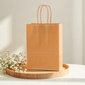 Factory Stock Kraft Paper Packaging Bag for Clothing Tea and Handbag Shopping Custom Logo Printed