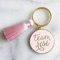 Wholesale Round Shape Custom logo Letter Enamel Gold Keychain Key Tag With Tassel