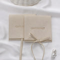 PUPPYSEW Wholesale Ivory Microfiber Jewelry Pouch Bag Handmade  Jewelry Packaging Pouch Personalized Logo Pouch With Flap