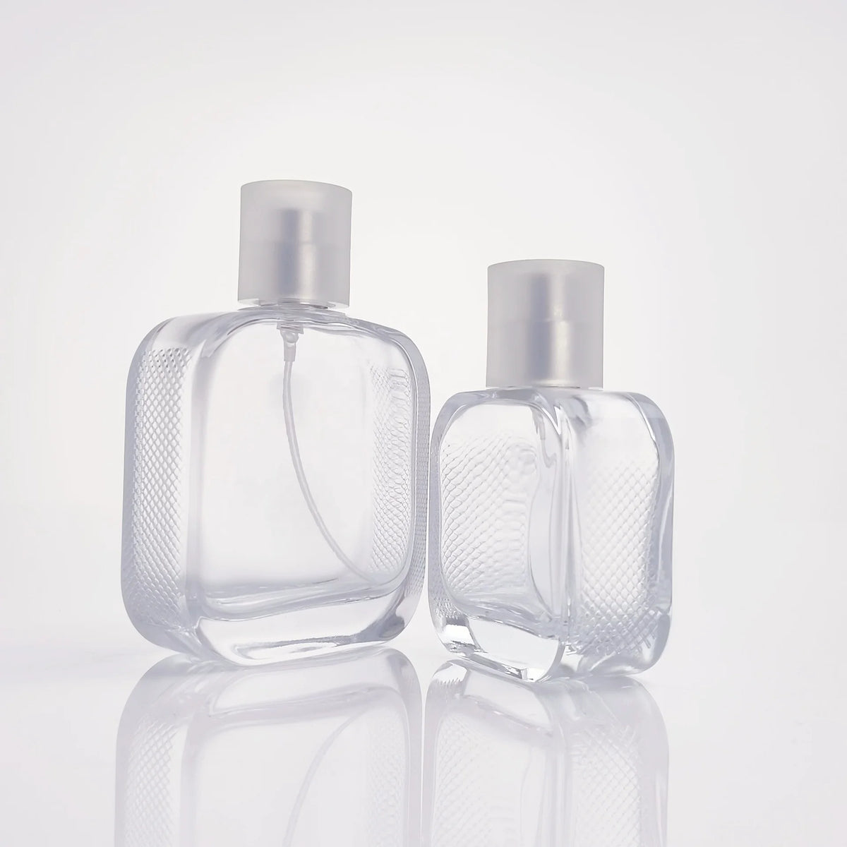 Wholesale Empty Glass Perfume Bottles 50ml 100ml Clear Custom Color Screen Printing Refillable Pump Sprayer OEM/ODM Available