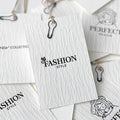 Luxury Custom Recycled Texured Paper Brand Apparel Tags with Custom Logo Double-Sided Embossed Gold Foil Hang Tag for Clothing