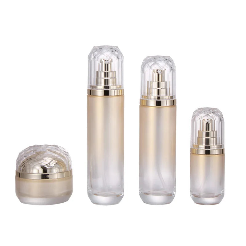 Wholesale Custom logo Luxury 50g 40ml 100ml and 120ml Grade Gold Cosmetic Glass Bottle and Jar with Gold Pump and clear Cap