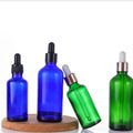 Wholesale Luxury Blue & Green 30ml Round Glass Bottles Dropper Cap Screen Printing TUV/ISO Certified Carton Packing MOQ 100pcs