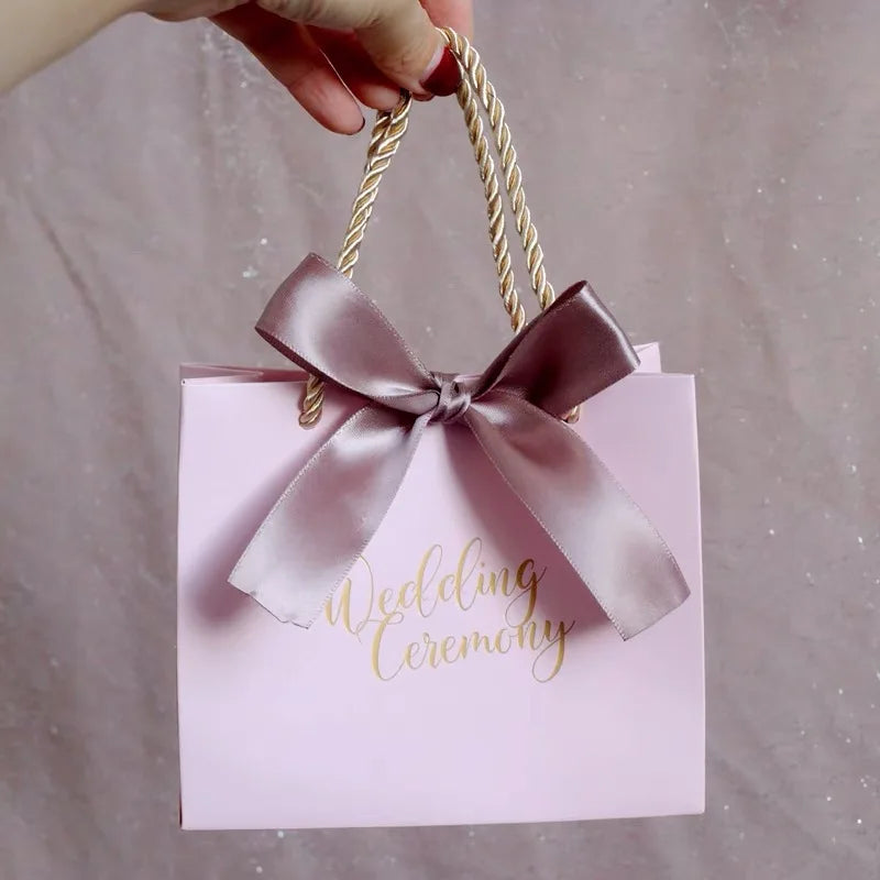 Custom Made Printed Logo Jewelry Packaging Kraft Shopping Paper Bag With Ribbon Handles Gold Foil Pink Gift Paper Bag