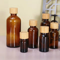 Custom logo Essential Oil Amber Glass Bottle 5ml 10ml 15ml 20ml 30ml 50ml100ml Glas Bottle With Bamboo Screw Caps and Nesse