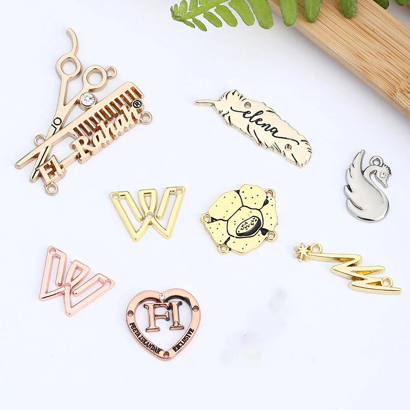 Gold Eco-Friendly Clothing Tag Accessories Wholesale Logo Engraved Electroplating Adhesive Back Sewing Stick Bag Garment Labels