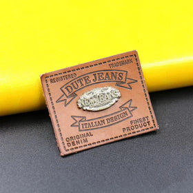 Hot Selling Custom Design Luxury Brand Trademark Eco-Friendly PU Material Garment Labels Custom Color Logo Debossed/Embossed