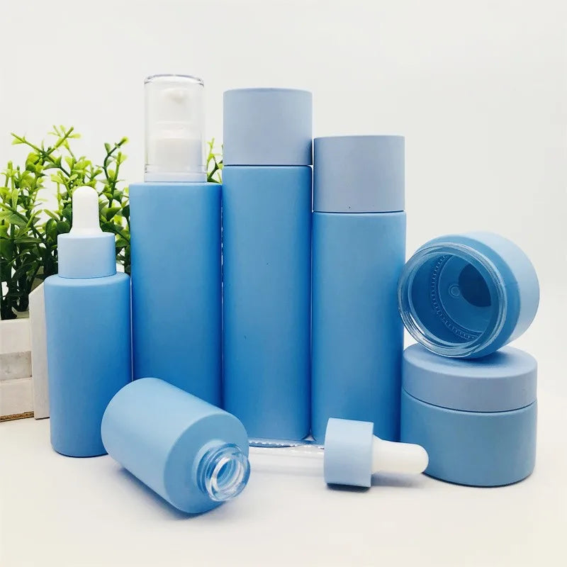 Luxury Eco Friendly Skincare Packaging Set Cosmetic Frosted Blue Flat Shoulder Glass Essential Oil Dropper Pump Bottle