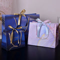 MU Purple Bowknot Art Paper Bag With Silk Ribbon Custom Logo Bag Clothes Garment Gift Bag Shopping