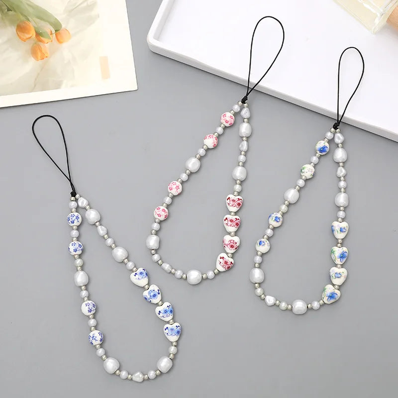 Ins New Pearl Love High-Grade Imitation Porcelain Beaded Mobile Phone Lanyard PVC CCd Camera Pendant Accessories Phone Chains