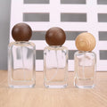 Wholesale Empty 30ml  50ml Screw Neck Clear  Flat   Refillable Perfume Spray Glass Bottle with Wooden  Cap