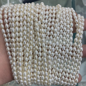 Factory Direct Price 1A 4-9mm Rice Shape Natural Freshwater Pearls String High Gloss Drop Pearl Strand