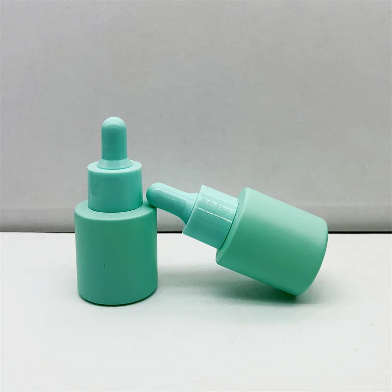 Wholesale Cosmetic Packing Green Pink Purple Black Glass Dropper Bottles 20ml 40ml 30ml Customized Essential Oil Dropper Bottle