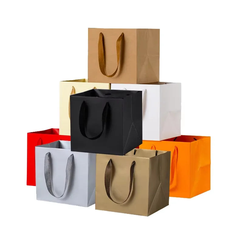 2026 Custom Printed Black White Paper Carry Shopping Clothes Paper Bag with Ribbon Handle for Clothing and Shoes Featuring Logo
