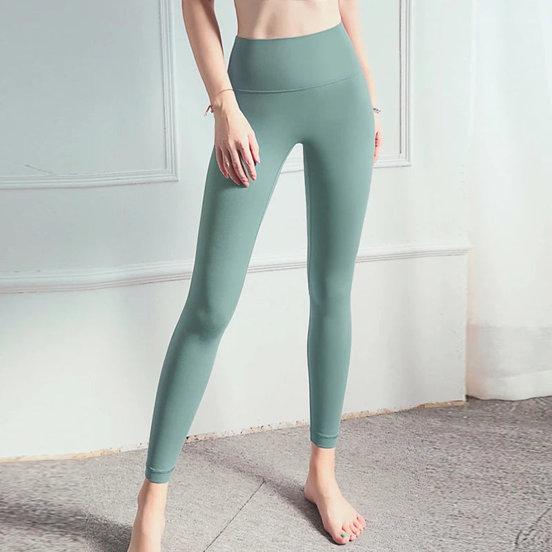 2026 No T-line Women's High-Waist Nine-Point Yoga Pants With Pockets Peach Hip Nude Plaid Tights Elastic Sexy Spandex Material