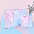 Luxury Holographic Recyclable Art Paper Custom Logo White Packaging Shopping Bags for Retail Stores MegaBDM