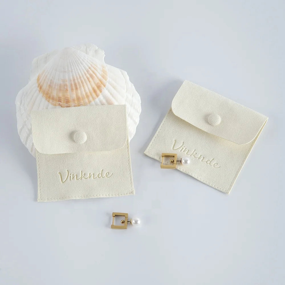 Custom 8x8 cm Ivory Suede Microfiber Luxury Jewelry Packaging Bag Pouch with Deboss Logo Fashionable Gift for Women and Girls