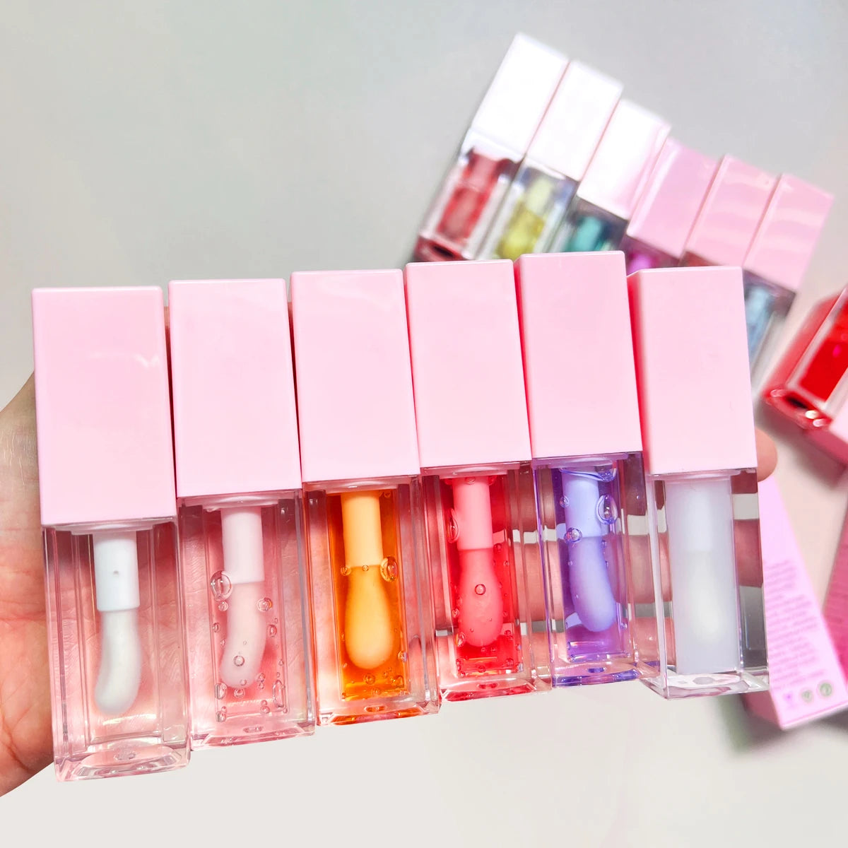 Low MOQ Vegan Flavoring Oil Private Label Lip Plumper Moisturizing Pink Glitter Flavor Color Changing Lip Oil