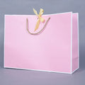 Wholesale Reusable Pink Paper Bag Gift Shopping Cardboard Bags With Bow for Clothes Wigs