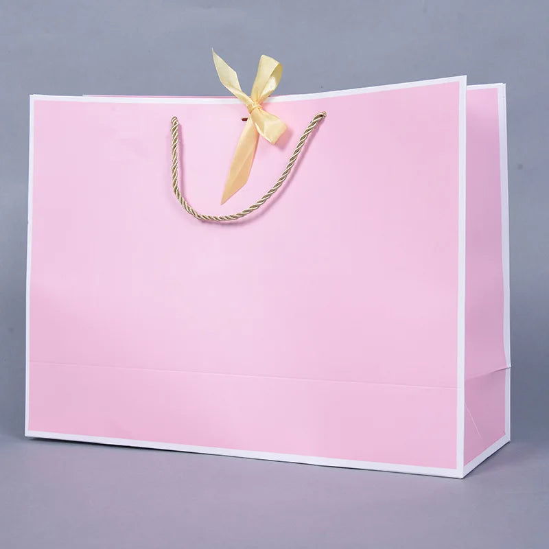 Wholesale Reusable Pink Paper Bag Gift Shopping Cardboard Bags With Bow for Clothes Wigs