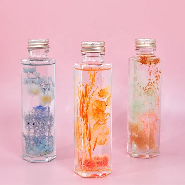 OEM Home Gift Decoration Eternal Preserved Dried Flower Herbarium in Oil Glass Bottle Christmas Floating Flowers Bottle