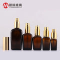 Empty 50ml Square Amber Glass Spray Bottle with Gold Top Pump Sprayer Screen Printed OEM Cosmetic Perfume Bottle