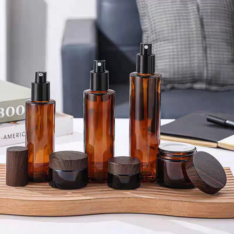 Custom logo 60ml 80ml 100ml 120ml Amber Pump Lotion Bottle Glass Lotion Jar Luxury Glass Cosmetic Bottles with Dark Wood Caps