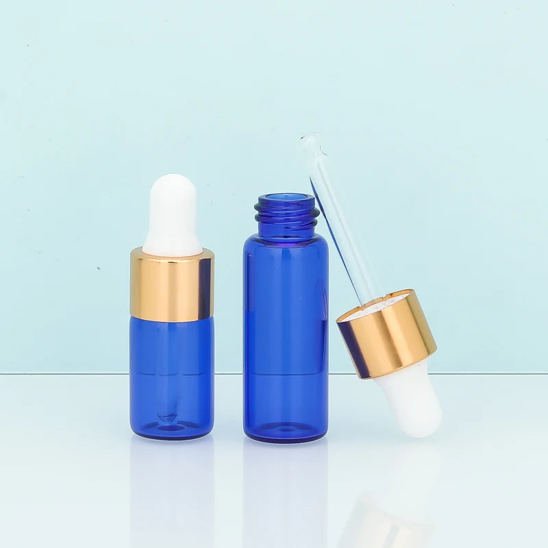 Jingtuo 2ml 3ml 5ml Luxury Blue Essencial Oil Glass Bottle Mini Blue Glass Bottle with Gold Dropper White Silicon for Skincare
