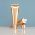 OEM ODM Luxury Round Shape Aluminum ABL Empty Laminated Tubes Custom Size Pink Gold Soft Plastic HDPE/ABL 50g Skin Care Tube