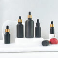Hot Sale 30ml Black Frosted Cosmetic Bottle Essential Oil Bottle with Measurement Pipette